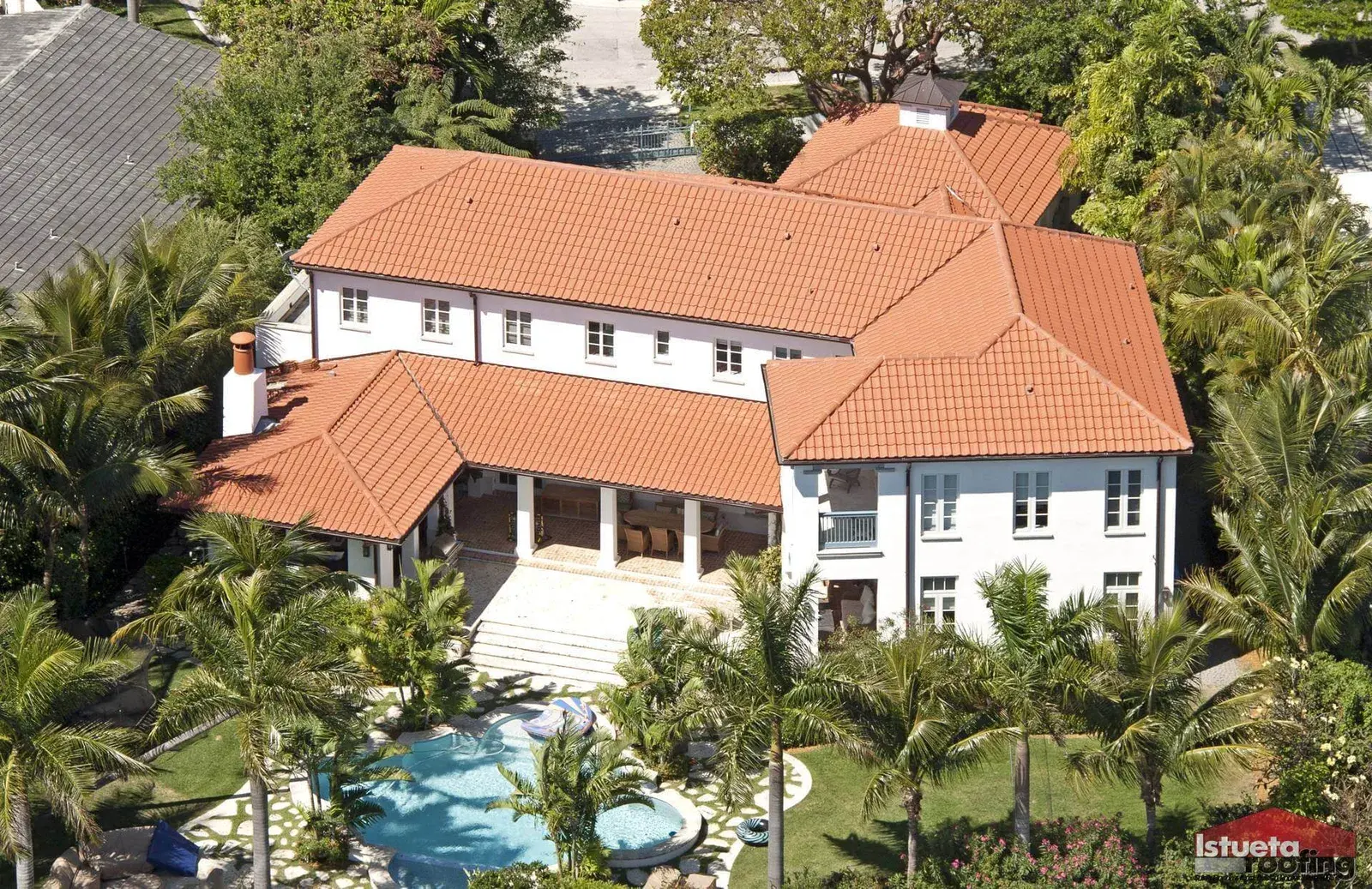 Mediterranean home with terracotta clay barrel tile roof and pool, Bay Point Miami.