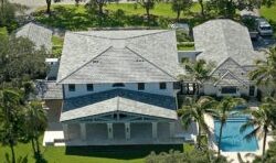 Luxury home with gray asphalt shingle roof