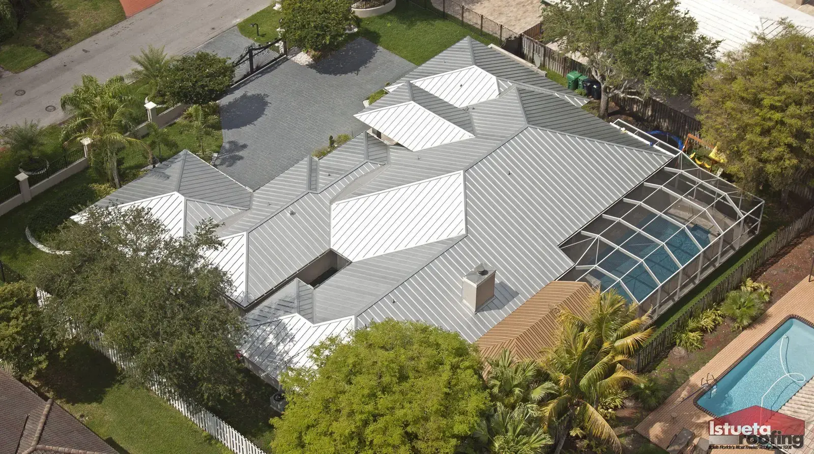 Architectural cutaway detail of galvalume standing-seam panel showing aluminum-zinc coating, steel substrate, and concealed-clip fastening system