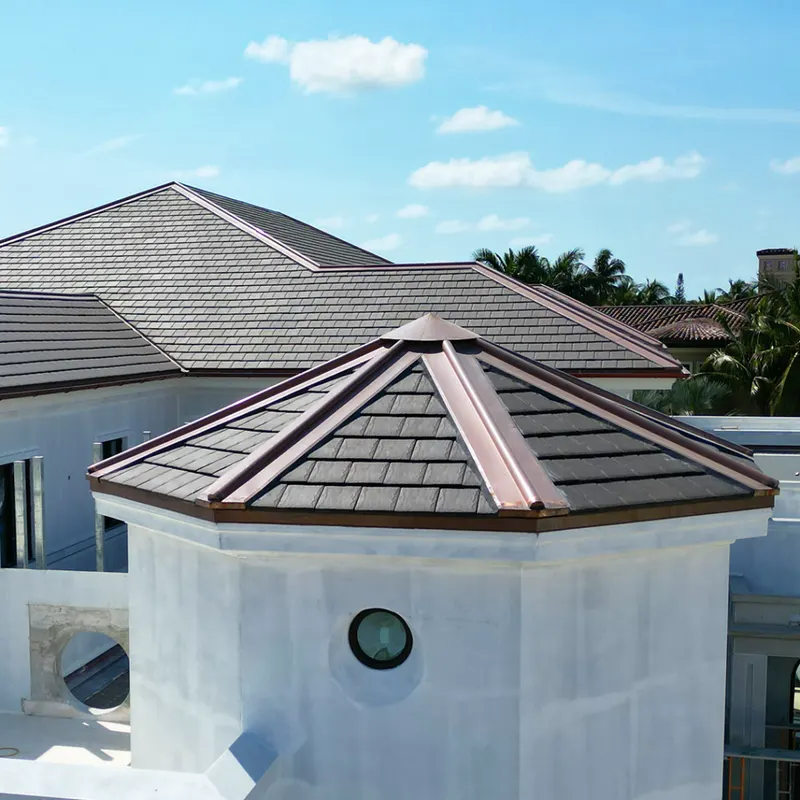 Gray Ludowici slate-profile tile roofs with copper ridge and hip caps