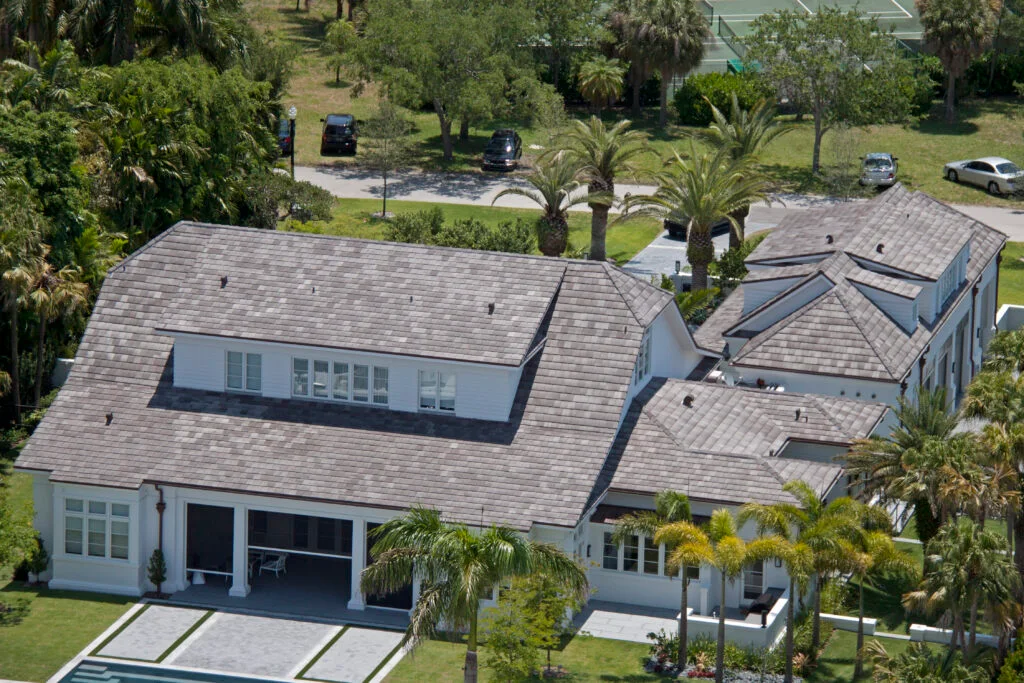 Aerial view of a coastal estate with gray Ludowici slate-profile tile