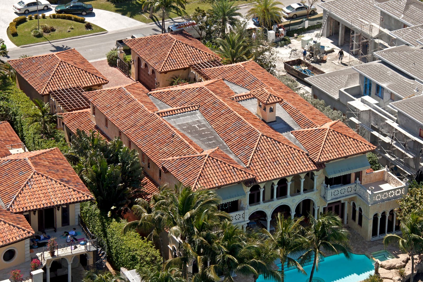 Mediterranean luxury estate in Bal Harbour with a terracotta barrel clay tile roof, aerial view.