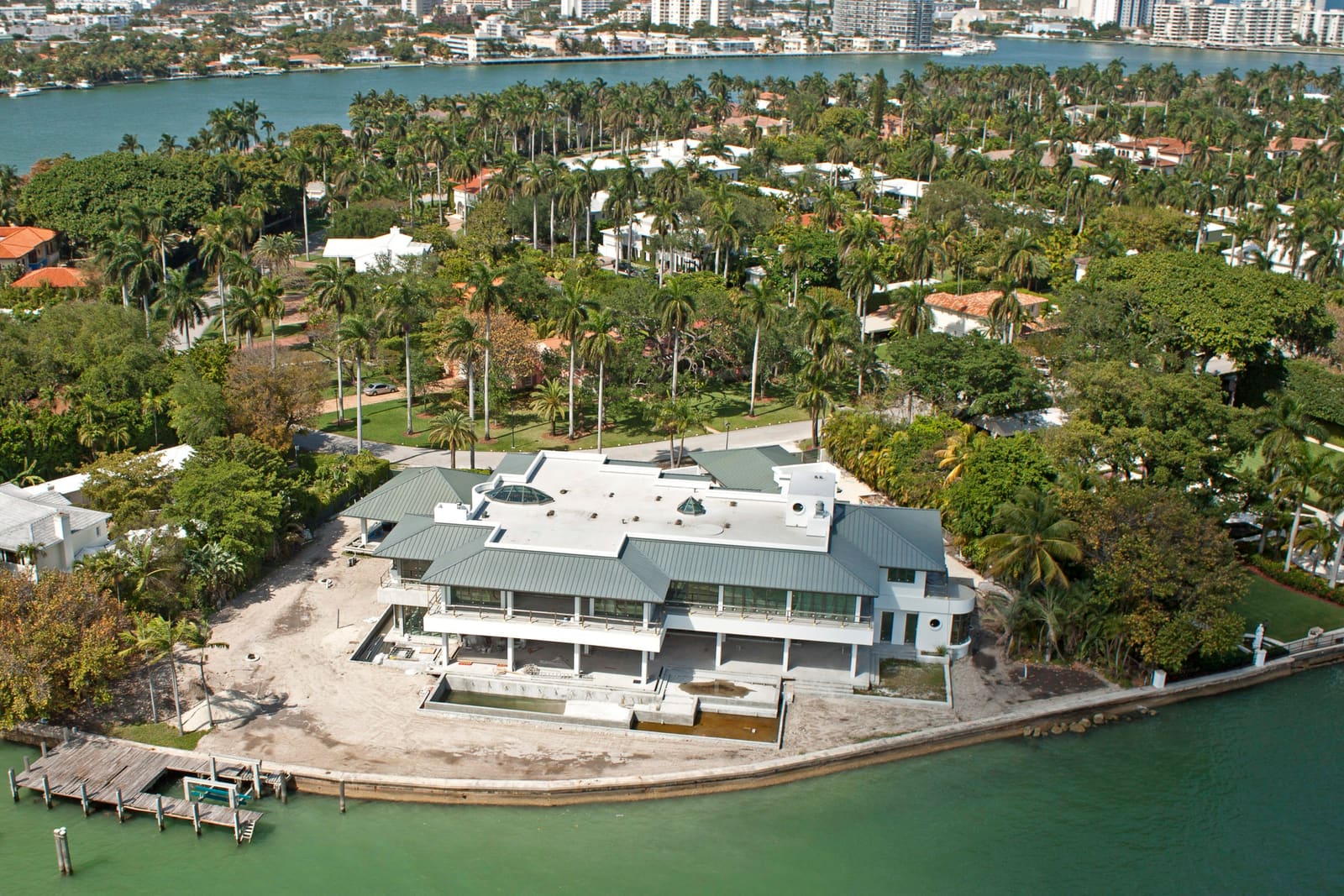 Standing-seam metal roof detail on a Miami Beach waterfront property, aerial view.