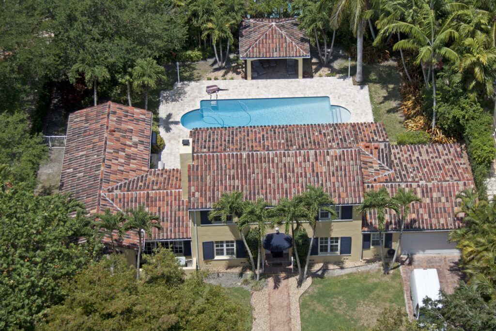 Aerial view of luxury home with gorgeous multicolored tile roof