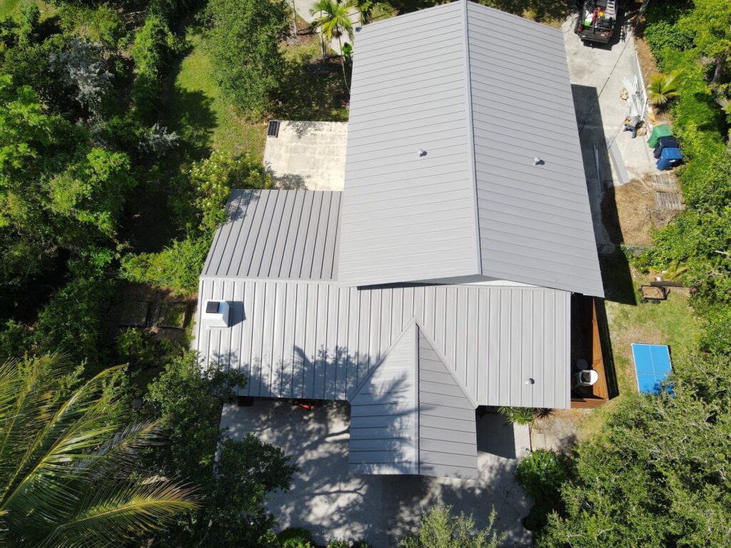 Aerial view of building with sleek gray aluminum roof