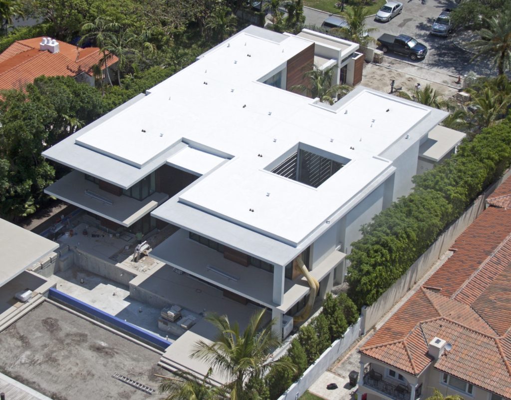 Top view of a multi-story building with a flat roof